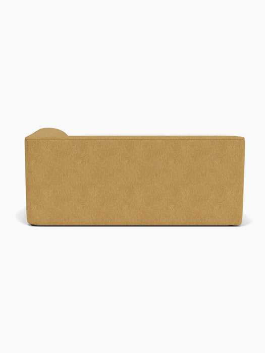 Back view of the Eave Modular Sofa, 96, Corner 192. The sofa is upholstered in a textured moss-coloured fabric.