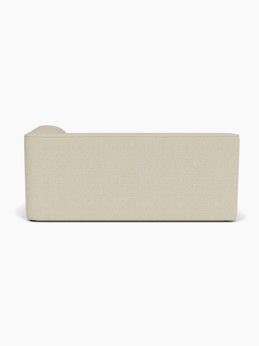 Full-length back view of the Eave Modular Sofa, 96, Corner 192 in a textured, light fabric against a white background.