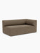 An angled view of the Eave Modular Sofa, 96, Corner 192, upholstered in a textured brown Safire 001 fabric.