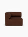 A front-on studio shot of the Eave Modular Sofa 96 Corner Left unit, upholstered in a textured, dark brown Bouclé 08 fabric.
