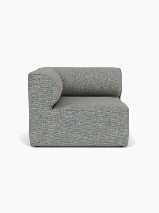 A front view of the Eave Modular Sofa, 96, Corner Left module, upholstered in a textured, mottled grey Safire 012 fabric.