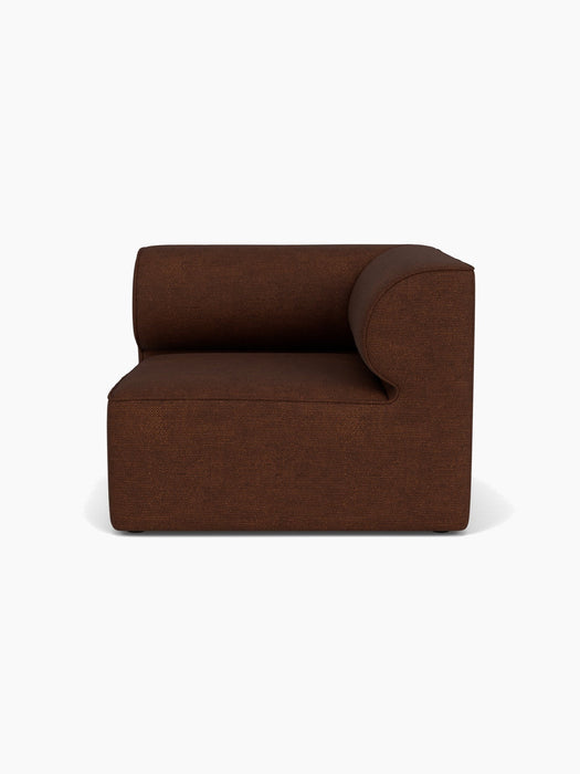 Front view of the Eave Modular Sofa, 96, Corner Right piece, upholstered in a textured, dark brown Audo Bouclé 08 fabric.