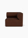 Front view of the Eave Modular Sofa, 96, Corner Right piece, upholstered in a textured, dark brown Audo Bouclé 08 fabric.