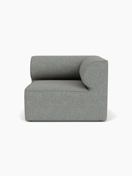 Front view of the Eave Modular Sofa, 96, Corner Right module, upholstered in a textured grey-blue Safire 012 fabric.