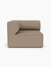Front view of the Eave Modular Sofa, 96, Left Corner section, upholstered in a textured light brown Logan Flint fabric.