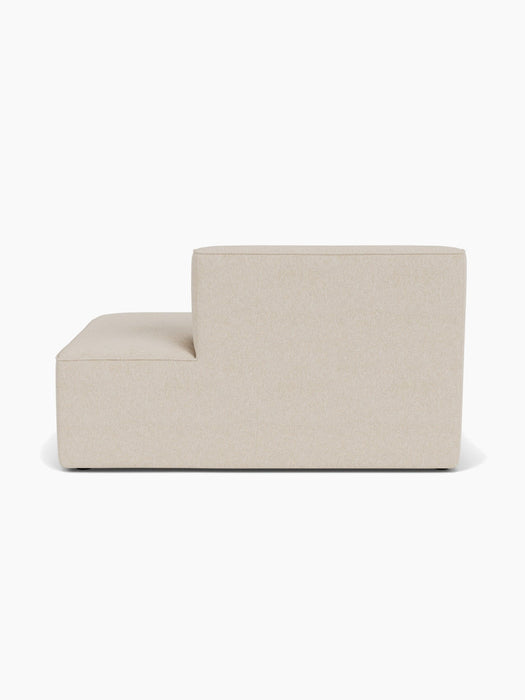 Back view of the Eave Modular Sofa, 96, Open End 144. The L-shaped module is upholstered in a light beige textured fabric.