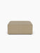 Front view of the Eave Modular Sofa Pouf, a square ottoman in light brown Audo Bouclé 02 fabric on a white background.