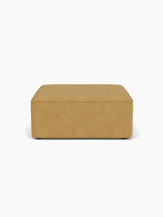 Front view of the Eave Modular Sofa Pouf 96 in a textured moss-coloured fabric, set against a plain white background.