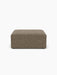 Front view of the Eave Modular Sofa Pouf, 96, upholstered in a textured brown Safire 001 fabric, on a white background.