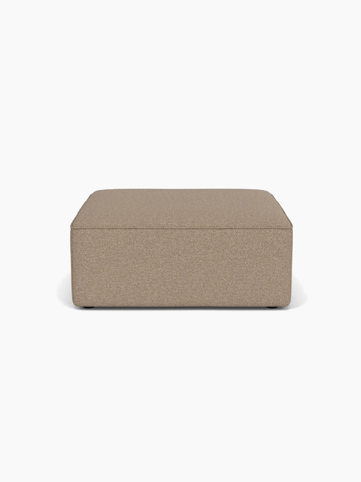 A front-on view of the Eave Modular Sofa, 96, Pouf in a light brown Logan Flint fabric, shown against a white background.