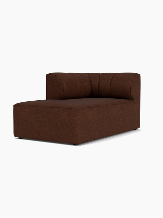 A three-quarter view of the Eave Seamline Modular Sofa's left-corner chaise longue module in a textured, brown bouclé fabric.