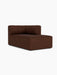 A studio shot of the Eave Seamline Modular Sofa, 86, Chaise Longue, upholstered in a textured, brown Audo Bouclé 08 fabric.