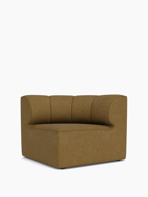 Frontal view of the Eave Seamline Modular Sofa's concave corner module. Upholstered in a textured brownish-gold fabric.