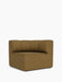 Frontal view of the Eave Seamline Modular Sofa's concave corner module. Upholstered in a textured brownish-gold fabric.