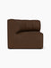 Left side view of the brown Eave Seamline Modular Sofa corner module, showing its curved backrest and textured bouclé fabric.