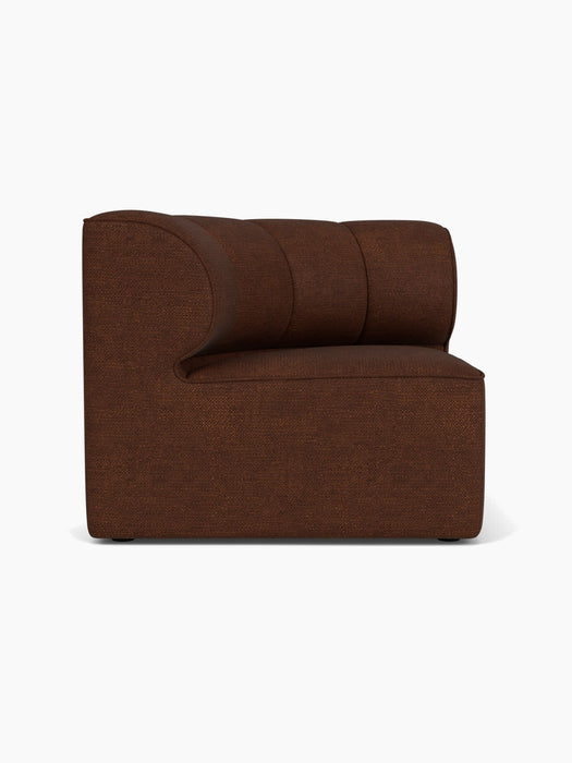 A left-hand Eave Seamline Modular Sofa, 86, Concave Corner module upholstered in a textured brown Audo Bouclé 08 fabric.