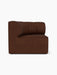 A left-hand Eave Seamline Modular Sofa, 86, Concave Corner module upholstered in a textured brown Audo Bouclé 08 fabric.