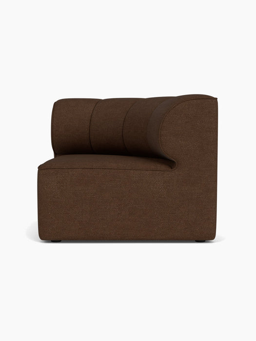 A right-side view of the Eave Seamline Modular Sofa's Concave Corner module in a textured, dark brown Audo Bouclé 07 fabric.