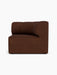 Eave Seamline Modular Sofa's concave corner module in dark brown bouclé fabric, viewed from the right.