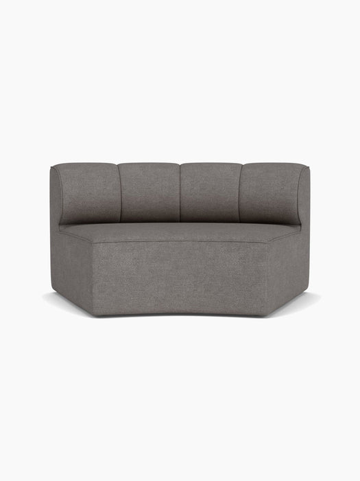 A front view of the Eave Seamline Modular Sofa, 86, Concave, Open Section, upholstered in a grey textured Audo Bouclé 16.