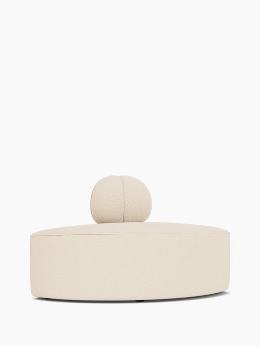 Eave Seamline Modular Sofa, Convex, Corner piece in a light bouclé fabric, with its curved seat and round backrest.