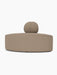 A front-on view of the Eave Seamline Modular Sofa's convex corner module in a textured, light brown Logan Flint fabric.