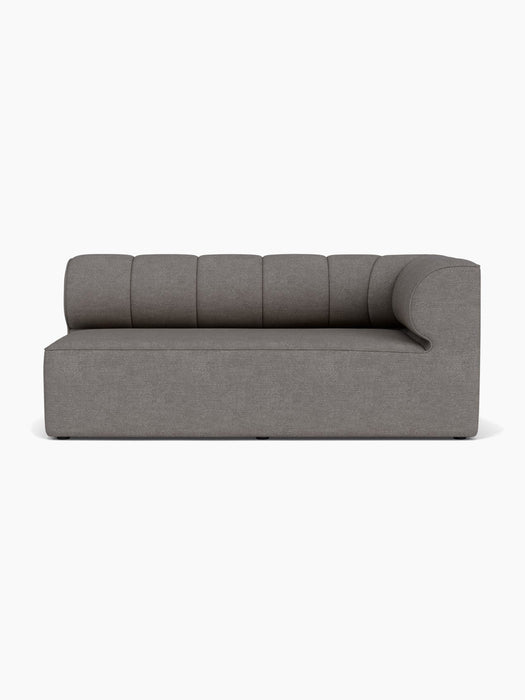 A front-facing, studio shot of the Eave Seamline Modular Sofa, Corner 172, in a textured grey Audo Bouclé 16 fabric.