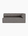 A front-facing, studio shot of the Eave Seamline Modular Sofa, Corner 172, in a textured grey Audo Bouclé 16 fabric.