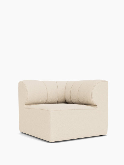 An angled view of the Eave Seamline Modular Sofa 86 Corner, featuring its textured light upholstery and stitched backrest.