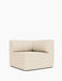 An angled view of the Eave Seamline Modular Sofa 86 Corner, featuring its textured light upholstery and stitched backrest.