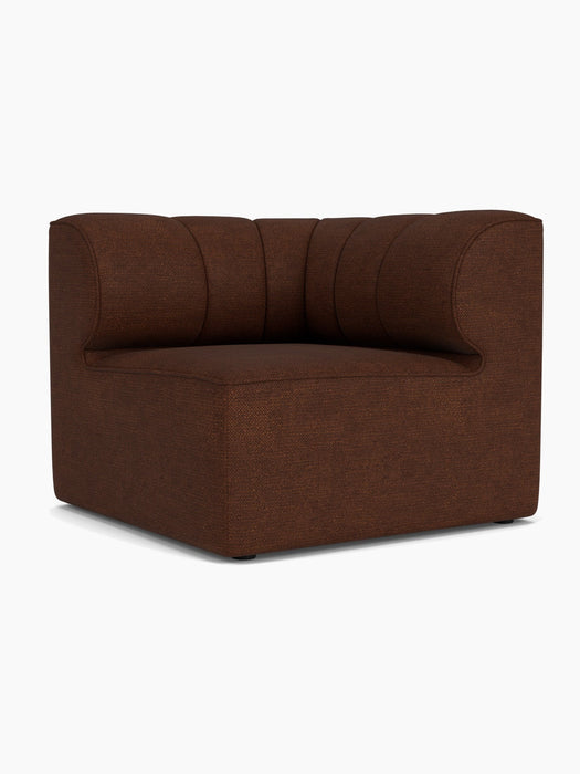 The Eave Seamline Modular Sofa 86 Corner module upholstered in dark brown Audo Bouclé 08 fabric on a white background.