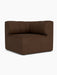 A brown bouclé Eave Seamline Modular Sofa, 86, Corner. It features a distinctive low back with vertical curved sections.