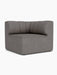 The Eave Seamline Modular Sofa 86 Corner module in dark grey Audo Bouclé fabric, showing its curved, seamed backrest.