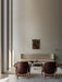Rear view of two Elizabeth Lounge Chairs facing a Radiohus Sofa, Androgyne Table, and Wing Lamp in a modern living room.