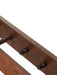 A close-up detail of the Epoch Rack 50 in dark stained oak, focusing on the wood grain and construction of the hooks.