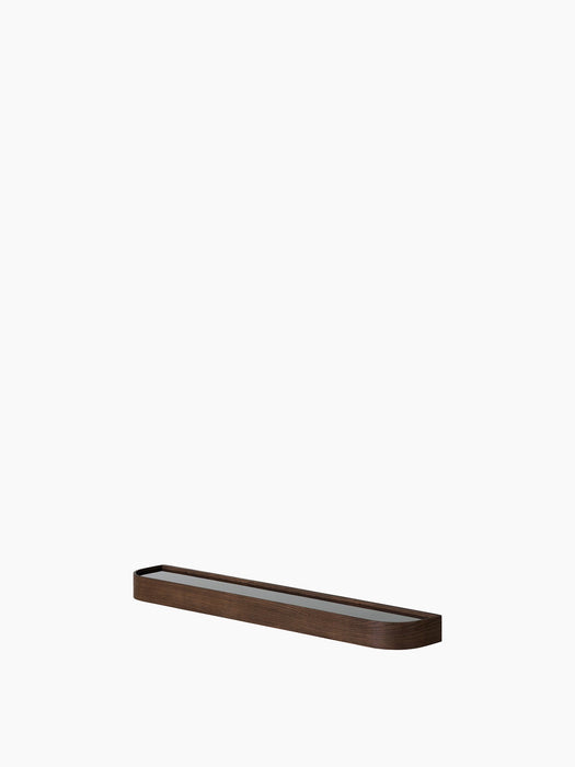 A long, narrow Epoch Shelf in dark stained oak with a reflective inlay, shown at an angle against a plain white background.