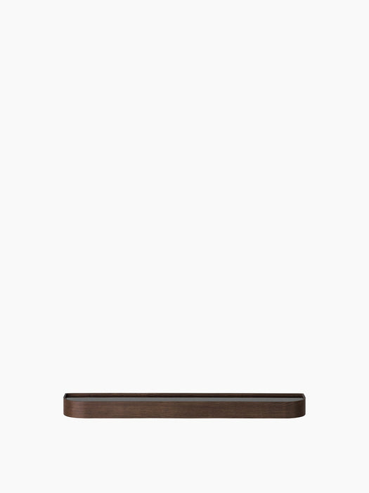 Front view of the dark stained oak Epoch Shelf. A long, minimalist wooden shelf with rounded corners on a white background.
