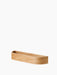 A high-angle view of the Epoch Shelf 50 in natural oak, featuring a long, rounded, minimalist design on a white background.