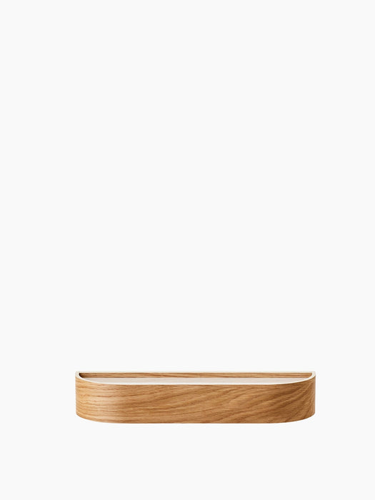 Low, front-on view of the Epoch Shelf 50 in natural wood finish. Minimalist design with a curved front edge.