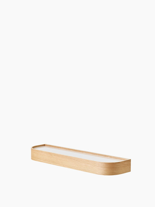 A low-angle shot of the Epoch Shelf 79 in Natural Oak. The long, narrow shelf has rounded ends and a raised wooden border.