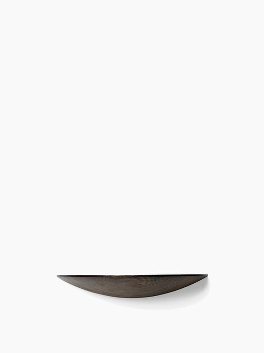 A front-facing view of the medium Gridy Fungi Shelf in dark ash, mounted on a white wall, highlighting its curved design.