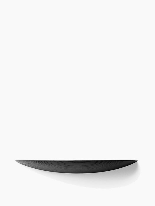 A large, black Gridy Fungi Shelf with a visible wood grain and a curved profile, viewed front-on against a white background.