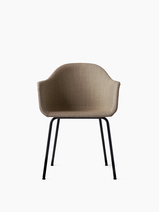 Front view of the Harbour Dining Chair. It has a beige upholstered shell with armrests and a slim, black steel base.