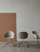 Three Harbour Dining Chairs with polished aluminium star bases. One is brown fabric with wheels, two have light shells.