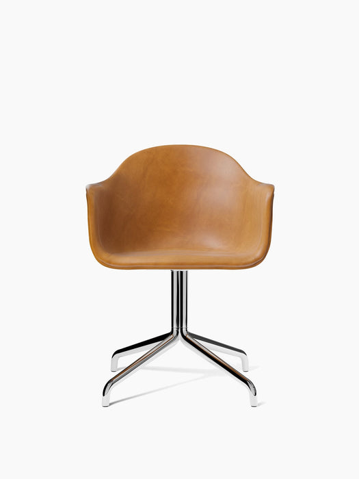Front-on view of the Harbour Dining Chair, upholstered in tan Dakar leather with a polished aluminium four-star swivel base.