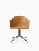 Front-on view of the Harbour Dining Chair, upholstered in tan Dakar leather with a polished aluminium four-star swivel base.