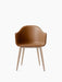 Front view of the Harbour Dining Chair featuring a contoured tan leather shell with integrated armrests and natural oak base.