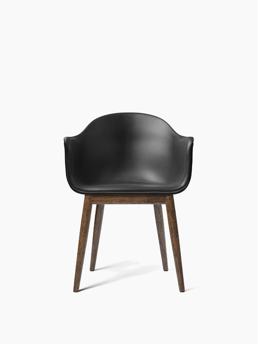 Front view of the Harbour Dining Chair with a black Dakar leather upholstered seat and a dark stained oak wooden base.