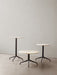 Three Harbour Column Tables in varying heights, including lounge, dining, and bar tables with marble tops and black bases.