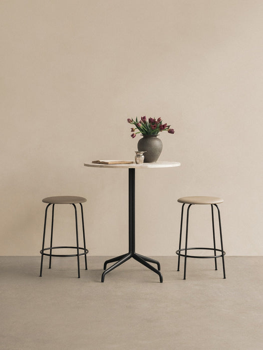 Harbour Column Counter Table with a white marble top and black star base, styled with two Afteroom Counter Stools and a vase.